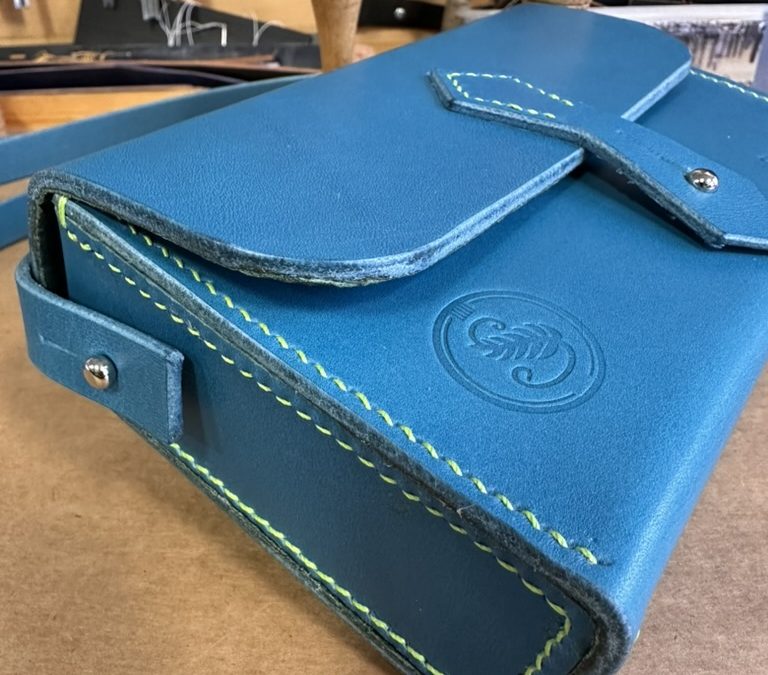 Bespoke Mini Box Bag, Turquoise veg tan leather, hand stitched in bright green waxed linen thread