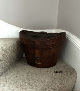 Reconditioned hat box sitting on corner stair